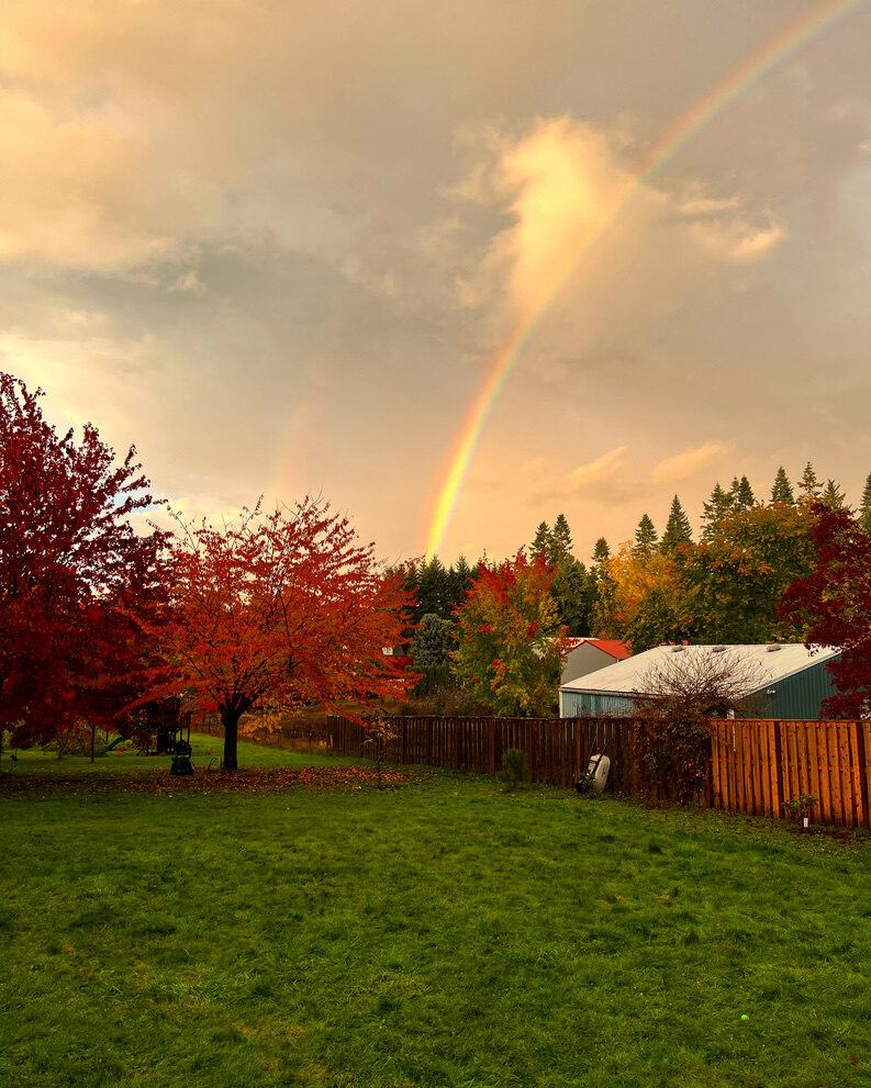 A double rainbow over the farm in autumn